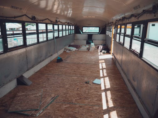 Laying floors in our skoolie was the first big project we go to do. | sincewewokeup.com | Since We Woke Up