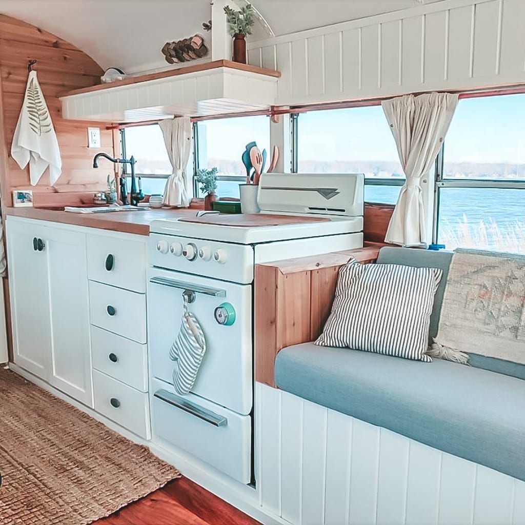 Today we're featuring the Fern the bus skoolie - a bus conversion with a bright, sunshine-filled interior and cool mint exterior! | Since We Woke Up | sincewewokeup.com