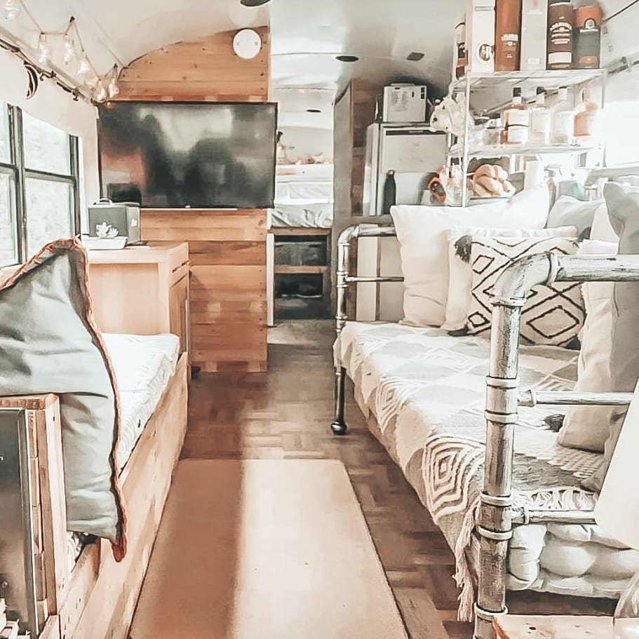 Today we're featuring the Real Buslife of Cheshire, a skoolie named Otto with a full kitchen, parquet floors, and a hanging table! | Since We Woke Up | sincewewokeup.com