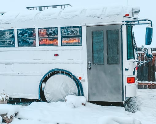 Living in a skoolie in the winter isn't just doable, it can be downright fun and cozy! Click here to learn our best winter RV tips! | www.sincewewokeup.com | Since We Woke Up
